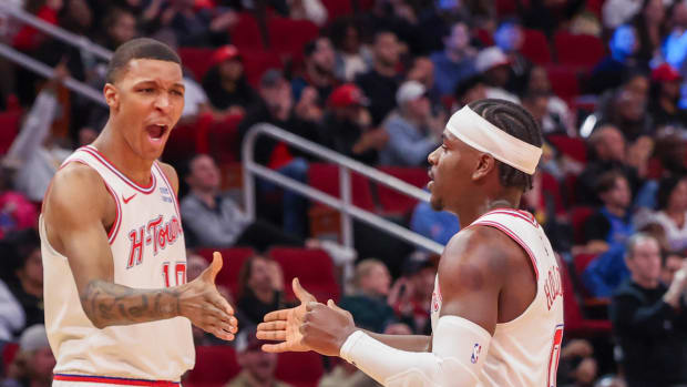 Rockets forward Jabari Smith Jr. reacts a basket by guard Aaron Holiday against the Oklahoma City Thunder in the second half at Toyota Center.